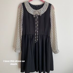 Navy blue dress with giraffe collar and sleeves